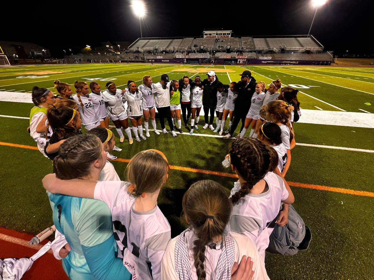 Coach Elliot Rimmer and the Clinton Lady Arrows celebrate a 2-1 win over Madison Central in the 2024 Class 7A North State Championship on Feb. 13 in Madison, Miss.